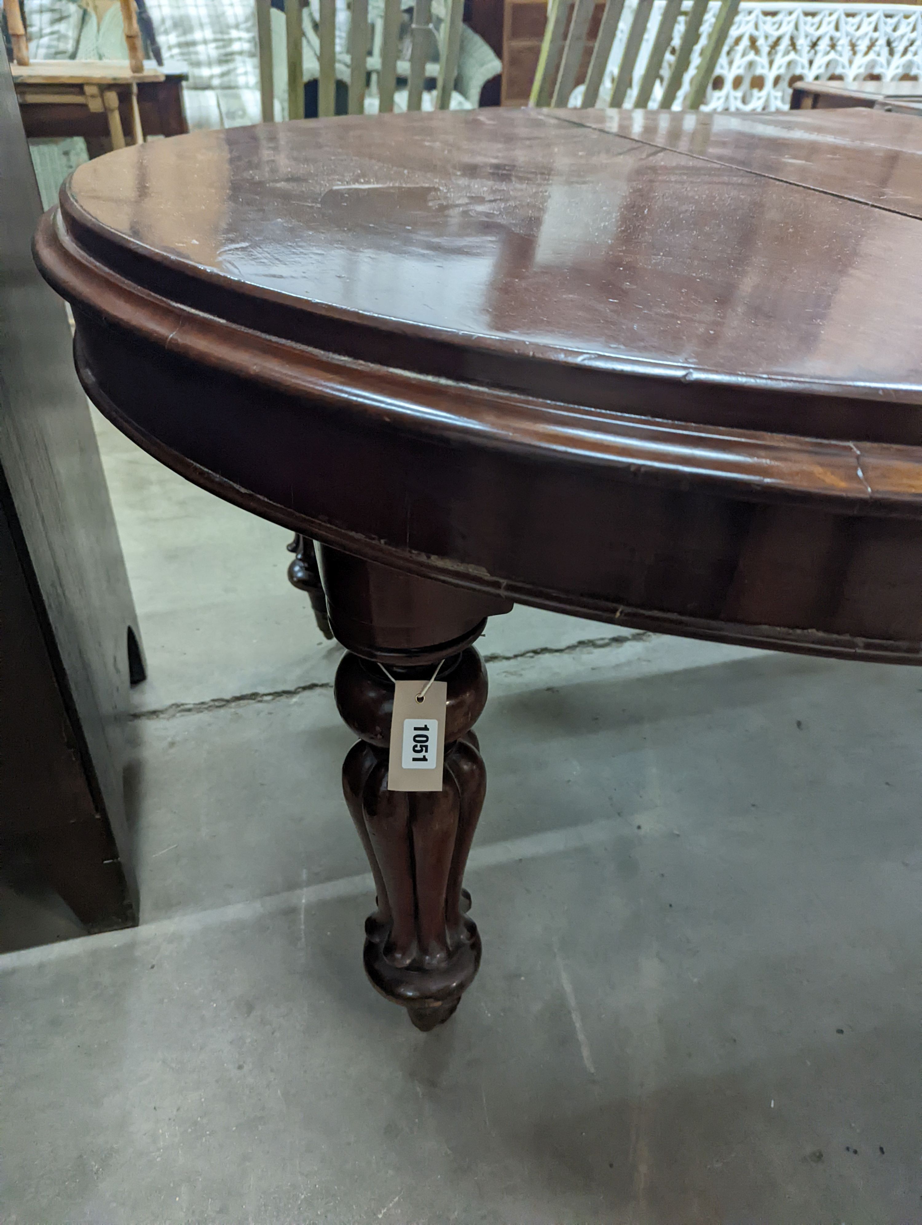 A Victorian mahogany extending dining table, length 170cm extended (two spare leaves), width 119cm, height 71cm